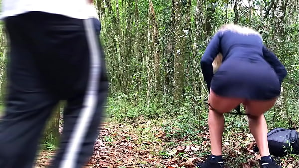 A milf went into the forest to pee, where she was caught and fucked by a stranger.