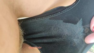 Wetting bikini with my urine under palm trees during vacation