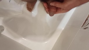 Peeing in the bathroom.