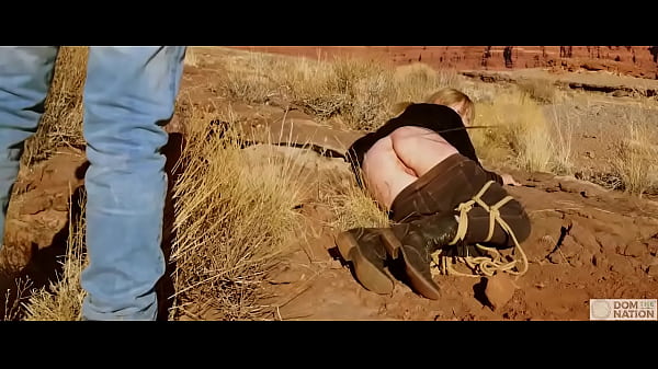 Submissive babe gets an asshole whipping before getting butt fucked on pee-covered ground — a hard, genuine domination adventure out in nature (Rebel Rhyder)